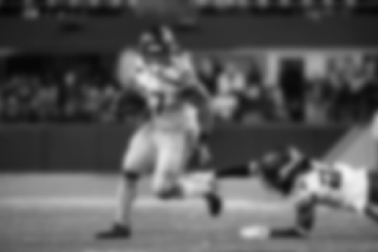 Seahawks running back Mike Davis escapes Vikings defensive back Holton Hill.