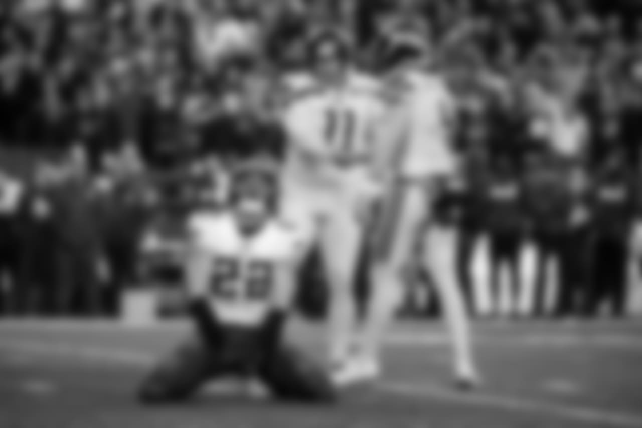 Seahawks kicker Sebastian Janikowski and holder Michael Dickson shake hands after a successful field goal try while Vikings defender Harrison Smith reacts.