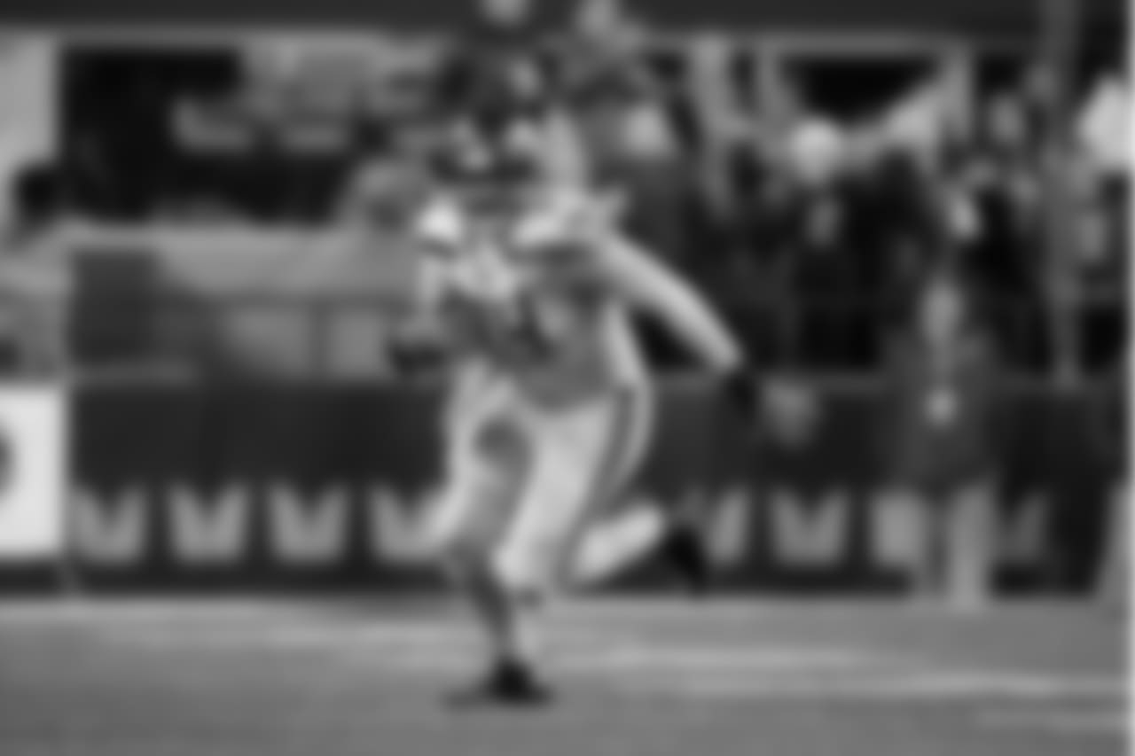 Seattle's George Fant, an offensive lineman who often lines up as an eligible receiver for blocking purposes, heads downfield after catching the first pass of his career.
