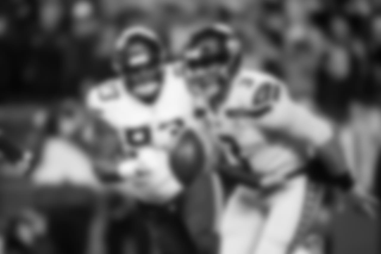 Seahawks quarterback Russell Wilson escapes pressure during the first quarter.