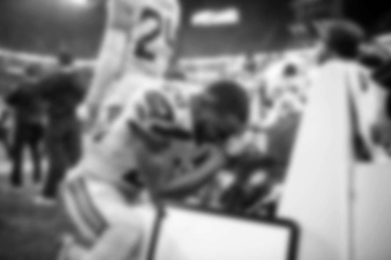 Cornerback Justin Coleman kneels and prays on the Seahawks sideline before kickoff.