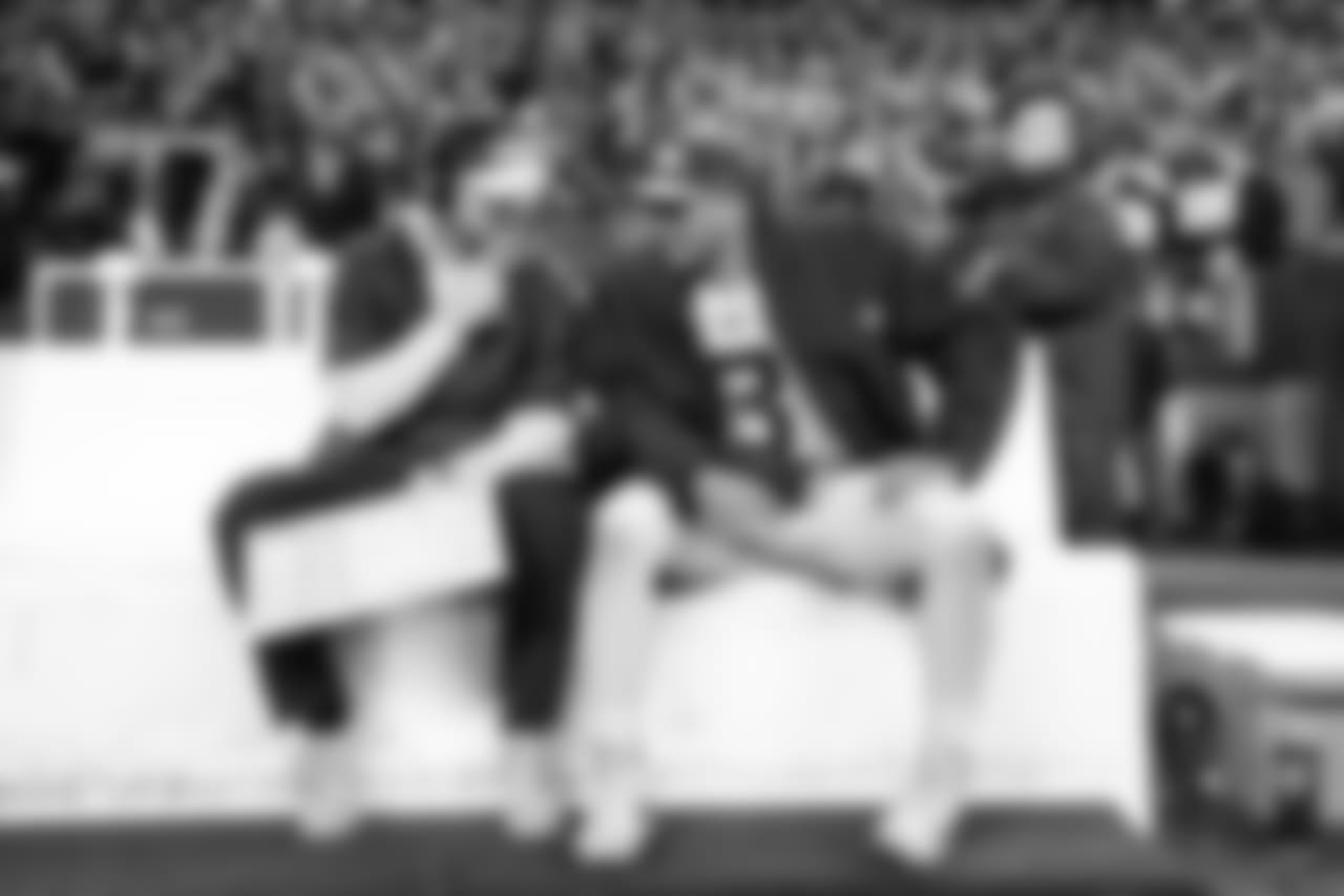 Seahawks offensive coordinator Brian Schottenheimer and quarterback Russell Wilson share thoughts on the sideline near the end of the game.