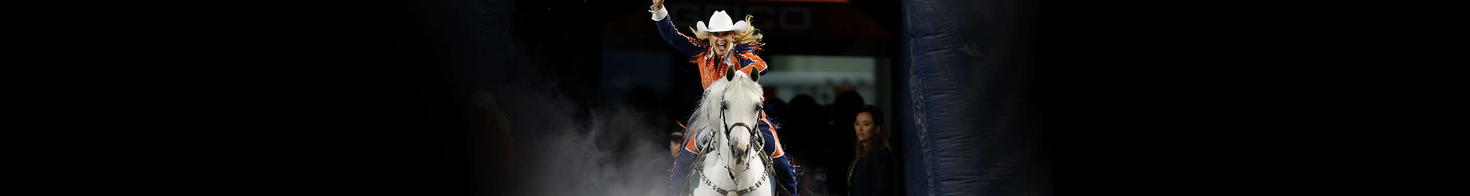 Denver Broncos Bucking Thunder Mascot With Football Player 