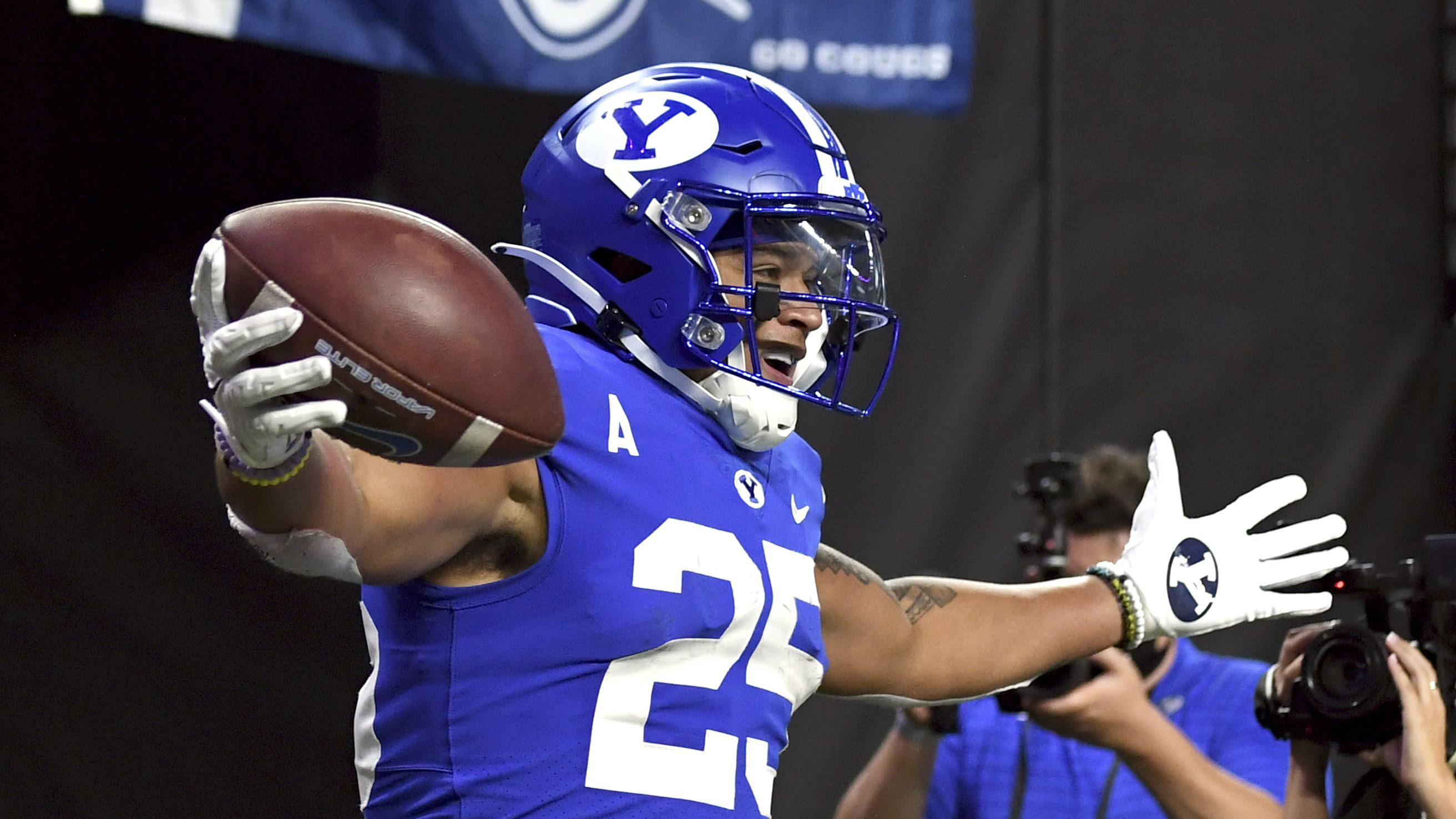 BYU running back Tyler Allgeier reacts after scoring a touchdown against Arizona during the first half of an NCAA college football game Saturday, Sept. 4, 2021, in Las Vegas. (AP Photo/David Becker)