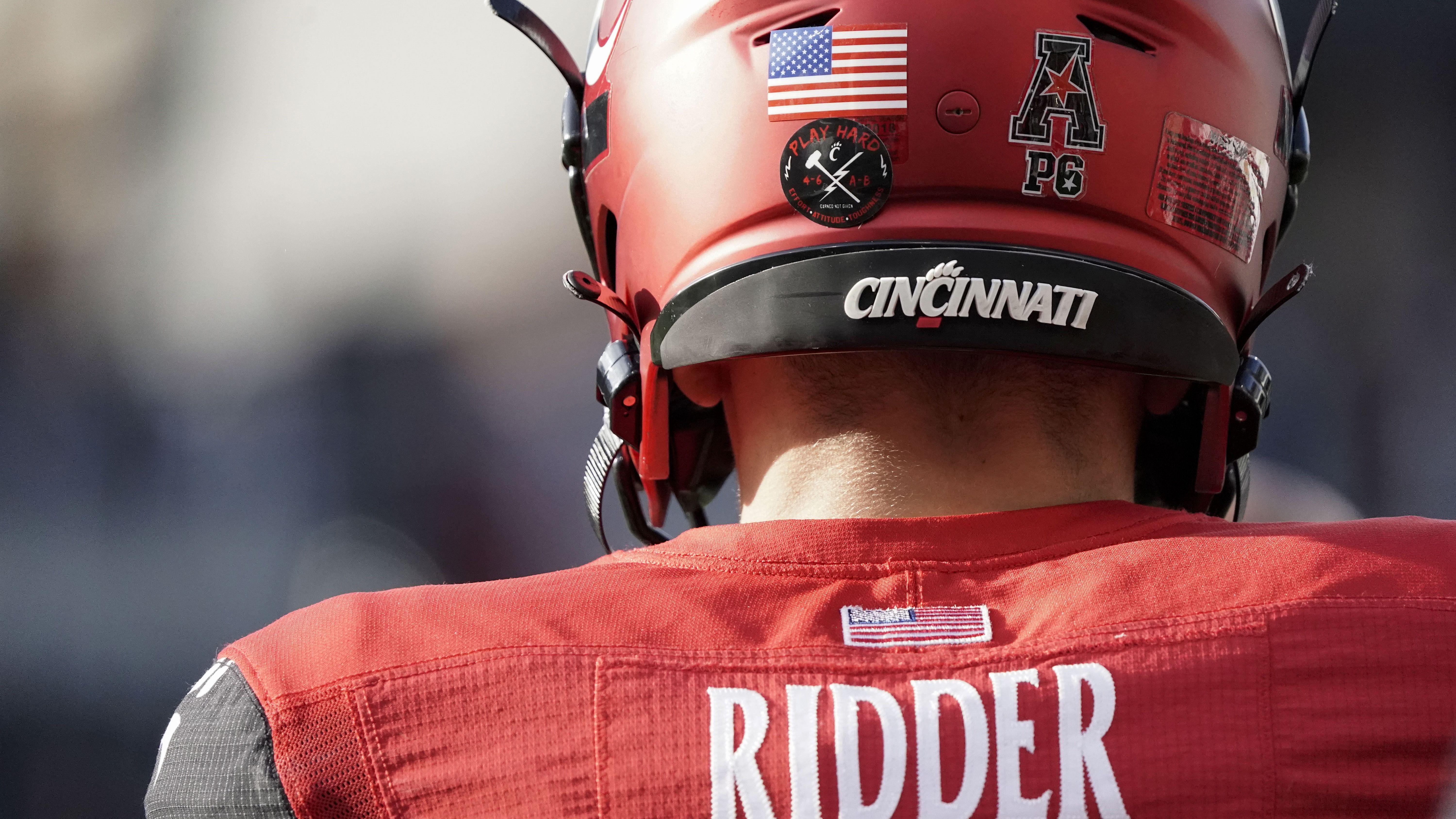 Cincinnati quarterback Desmond Ridder (9) plays during the American Athletic Conference championship NCAA college football game against Houston Saturday, Dec. 4, 2021, in Cincinnati. (AP Photo/Jeff Dean)