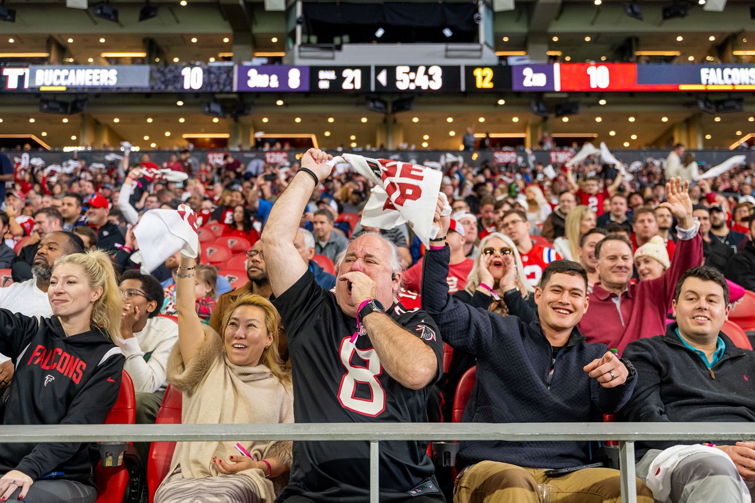 Hospitality Packages — Non-club tickets: fans cheering in Mercedes-Benz Stadium