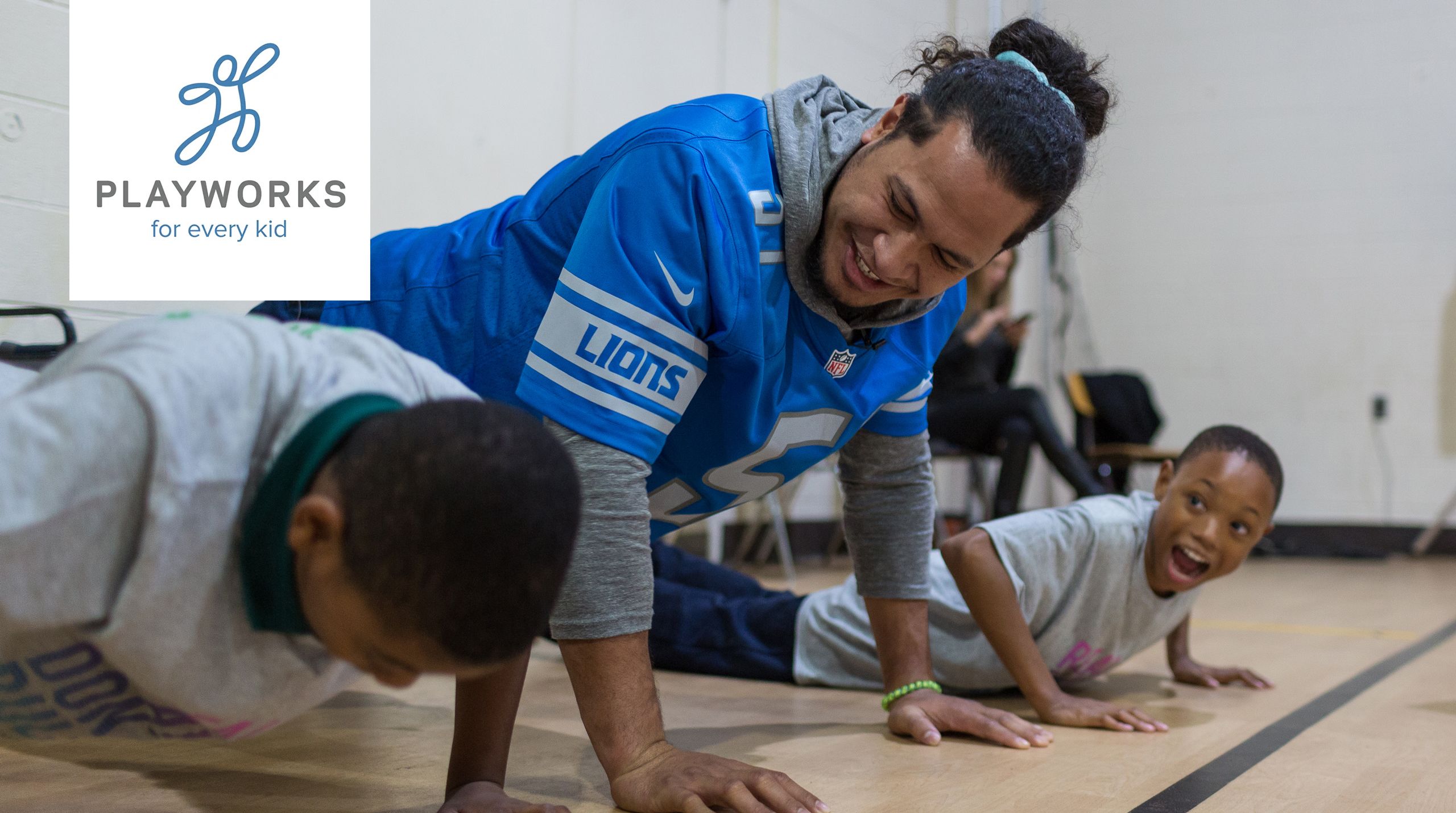 Detroit Lions linebacker Jahlani Tavai (51) does pushups with students at Mason Academy to celebrate National Bullying Prevention Month with Playworks Tuesday, Oct. 22, 2019 in Detroit.