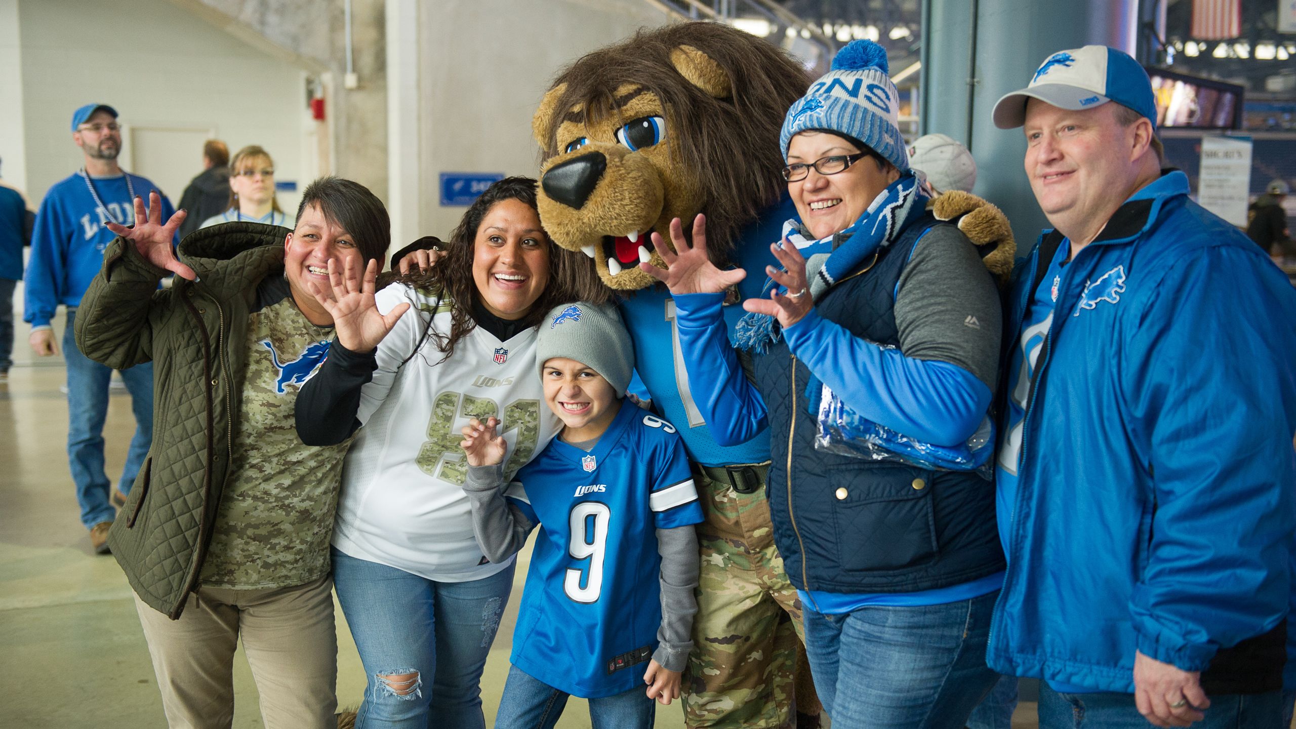 Detroit mascot Roary dressed in holiday attire stands on the sidelines  during an NFL football game between the Detroit Lions and the Arizona  Cardinals in Detroit, Michigan USA, on Sunday, December 19