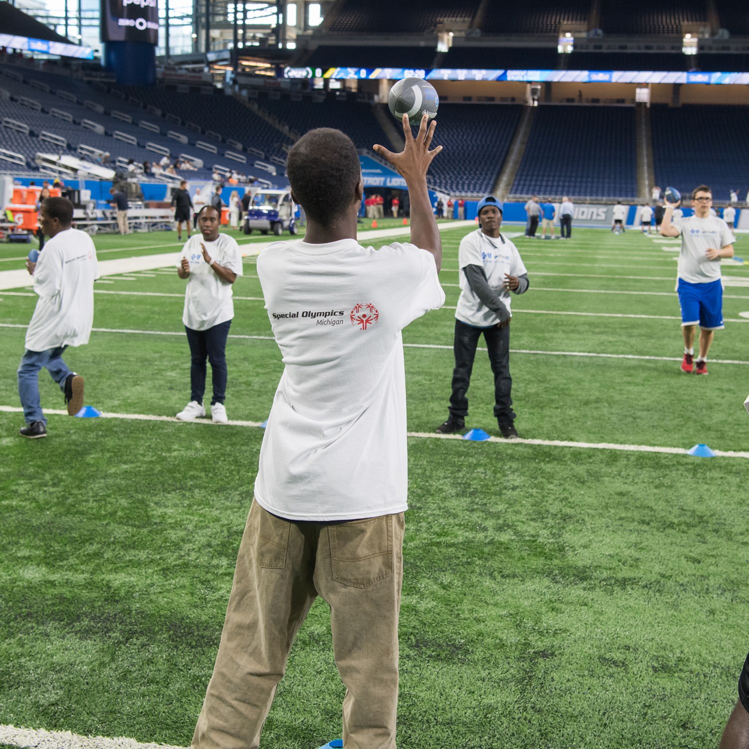 Children involved with Play 60 run onto the field to participate in a game  of flag football during half time of a preseason NFL football game between  the Tampa Bay Buccaneers and