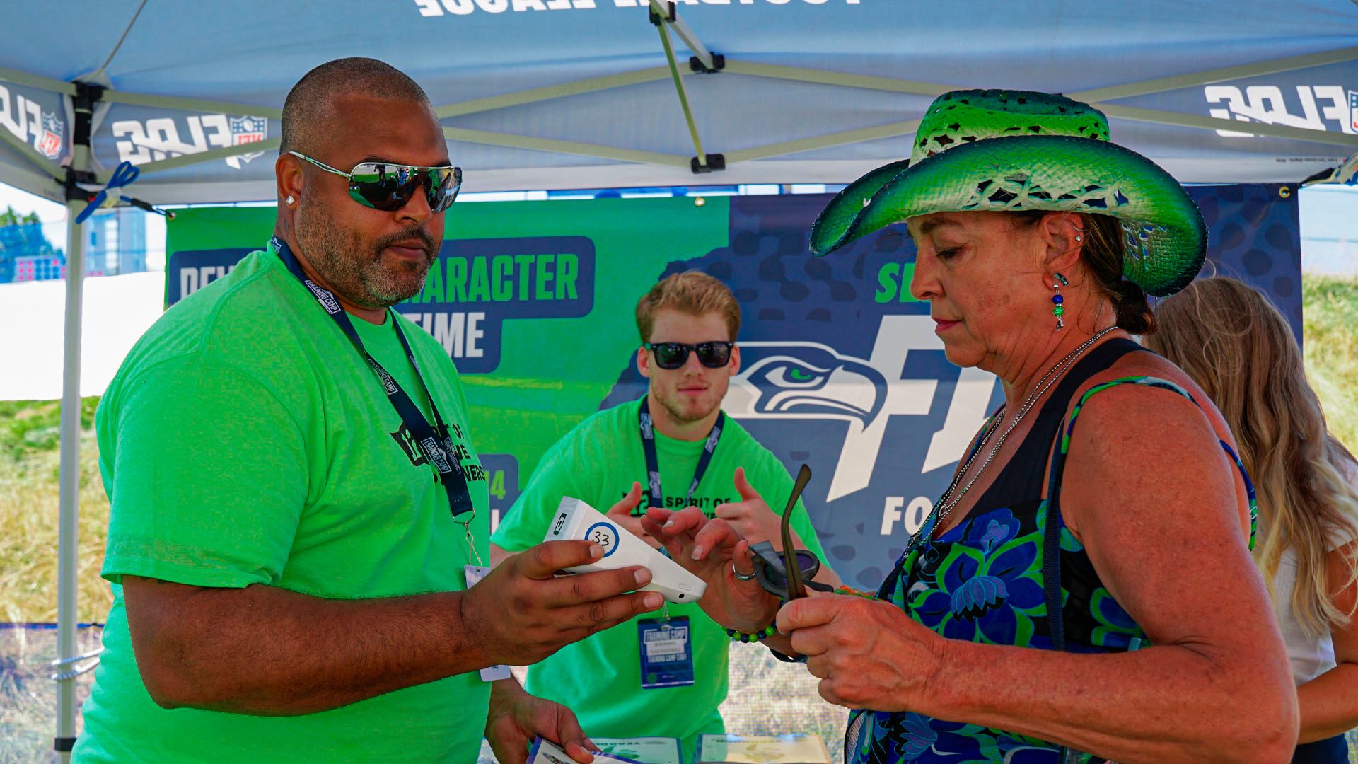 A Seahawks Fan Paying at Training Camp