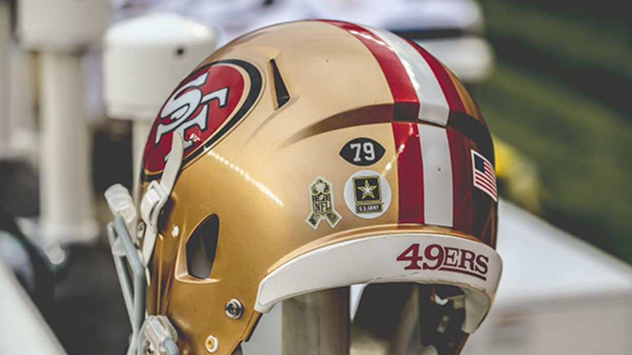 Golden Color Helmet With San Francisco 49ERS Log On Green Grass 4K