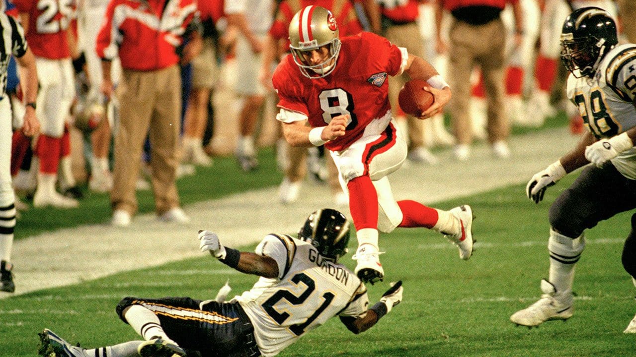 NFL FILE: Jerry Rice (80) and Steve Young (8) of the San Francisco 49ers  during Super Bowl XXIX at Joe Robbie Stadium in Miami, Florida. Young threw  a record 6 touchdowns and