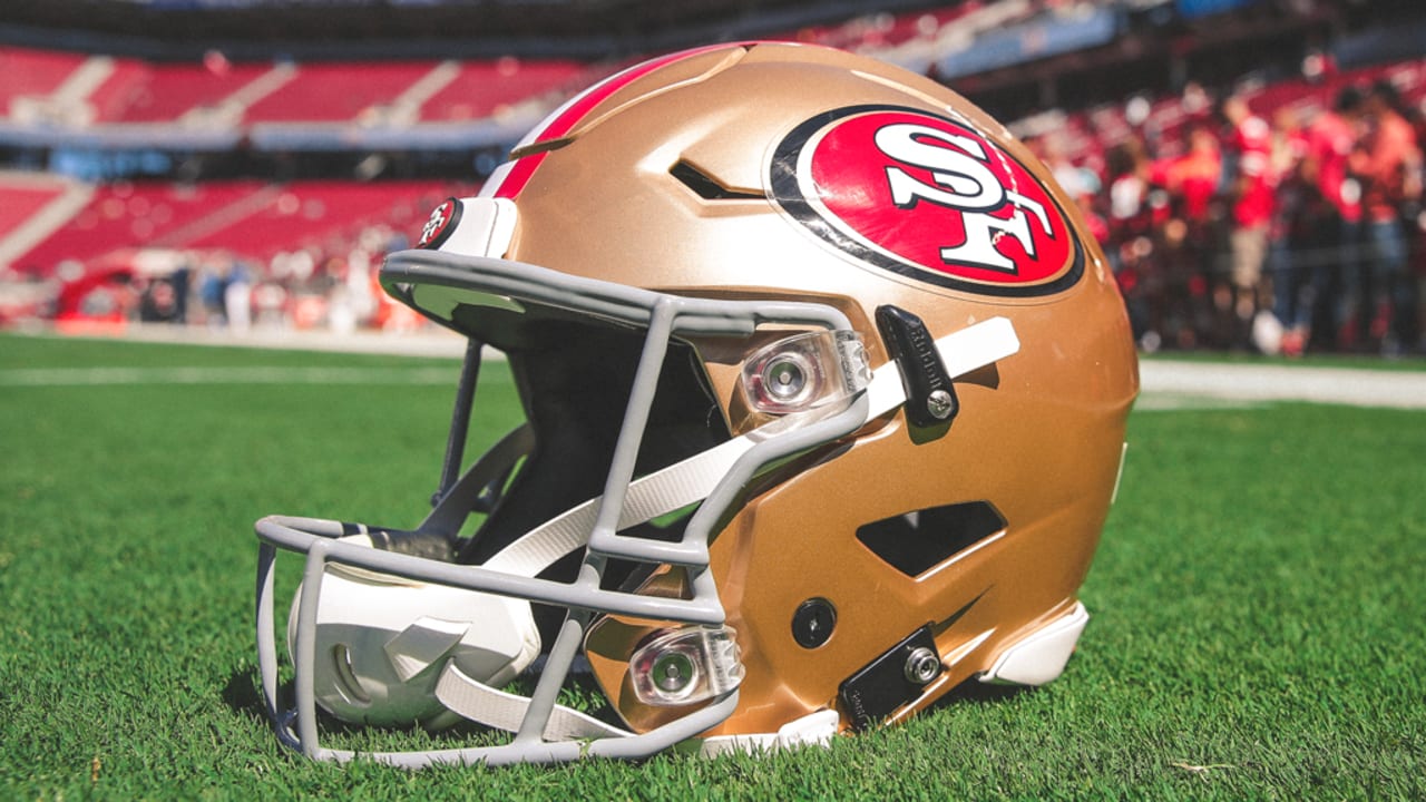 A San Francisco 49ers helmet sits on the sideline during an NFL