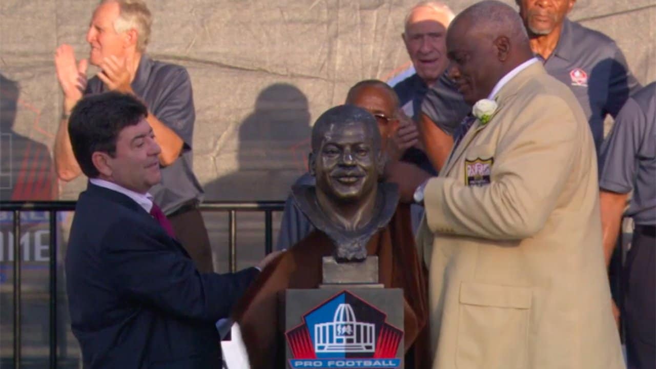 Edward DeBartolo, Jr., former owner of the 49ers, helps Fred Dean, of the  San Diego Chargers and the San Francisco 49ers, unveil his bust at the Pro  Football Hall of Fame 2008