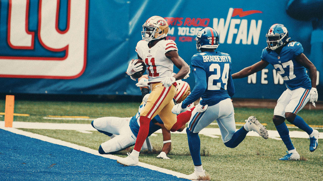 San Francisco 49ers wide receiver Brandon Aiyuk (11) celebrates scoring a  touchdown with quarterback Nick Mullens (4) against the New York Giants  during an NFL football game, Sunday, Sept. 27, 2020, in