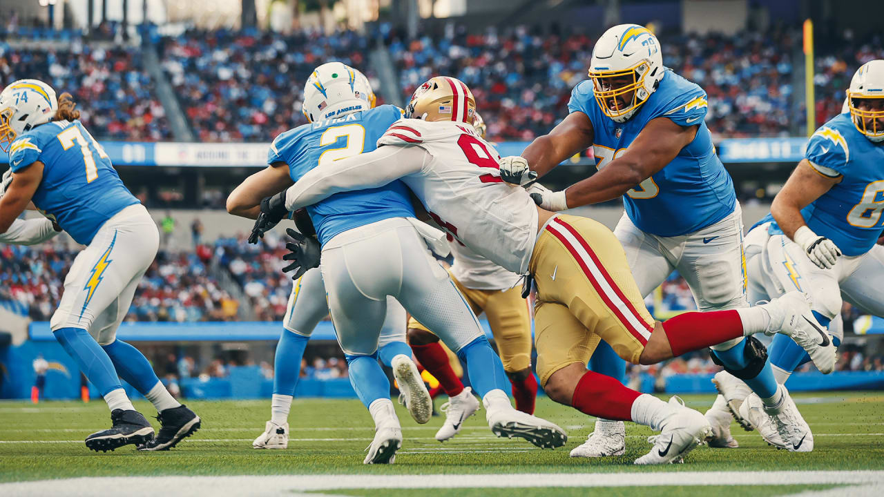 San Francisco 49ers defensive lineman Jordan Willis, right, is hugged by  teammates after sacking Los Angeles Chargers quarterback Easton Stick in  the end zone for safety during the first half of a