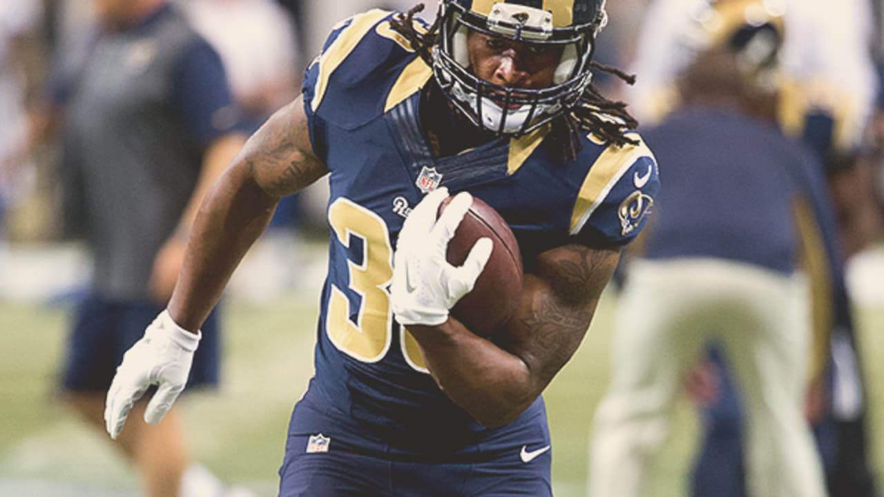 Los Angeles Rams running back Todd Gurley (30) runs for a touchdown against San  Francisco 49ers defensive back Dontae Johnson (36) during the first half of  an NFL football game in Santa