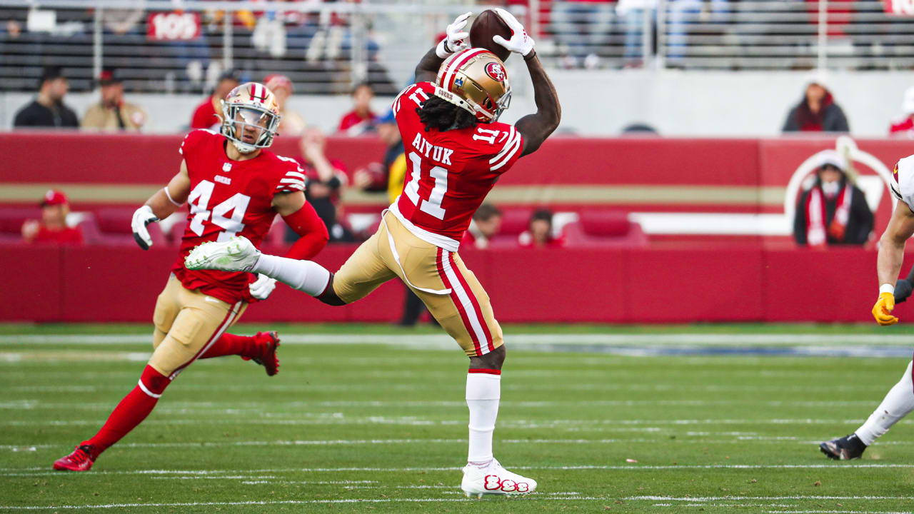 San Francisco 49ers quarterback Brock Purdy overthrows wide-open 49ers wide  receiver Deebo Samuel on a deep route