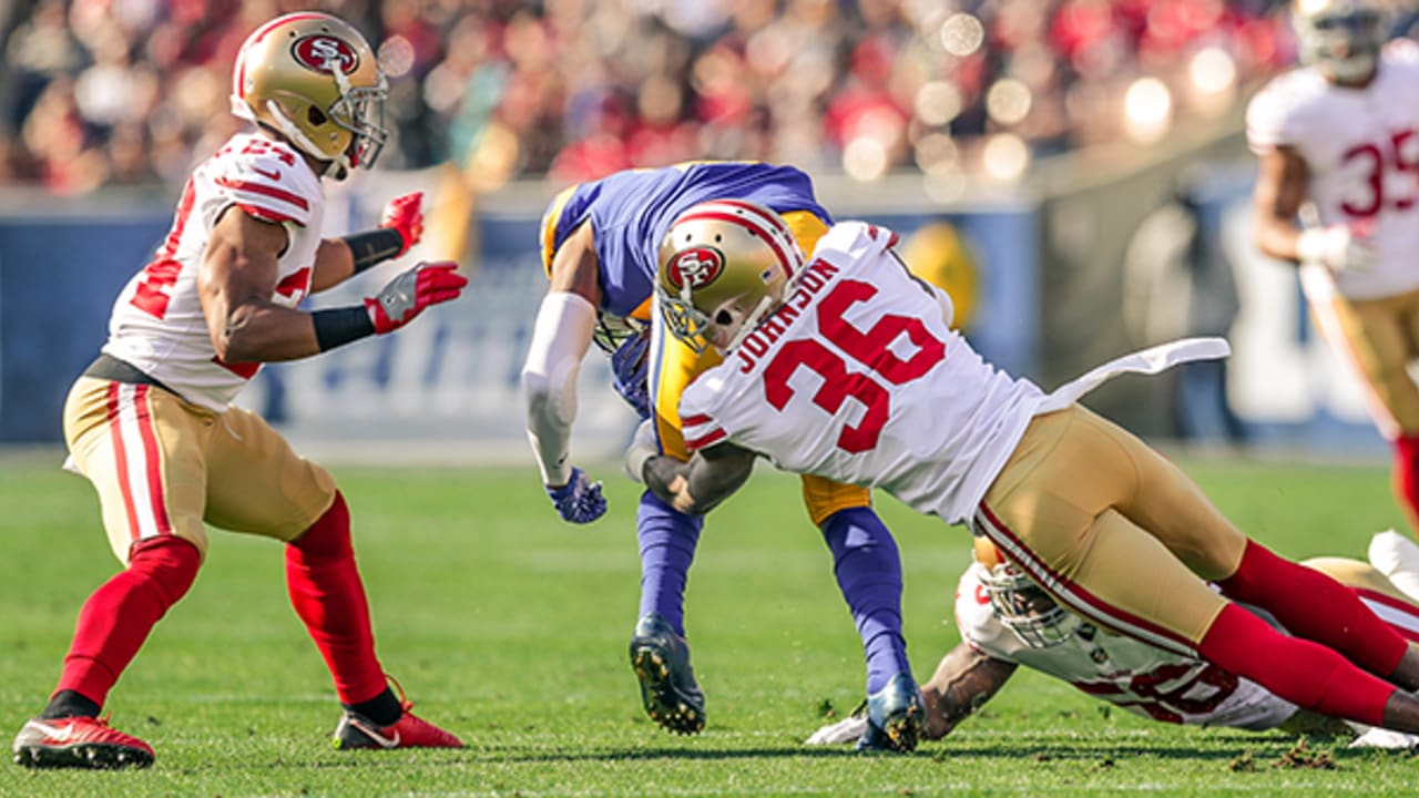 San Francisco 49ers Charlie Krueger on sidelines putting helmet