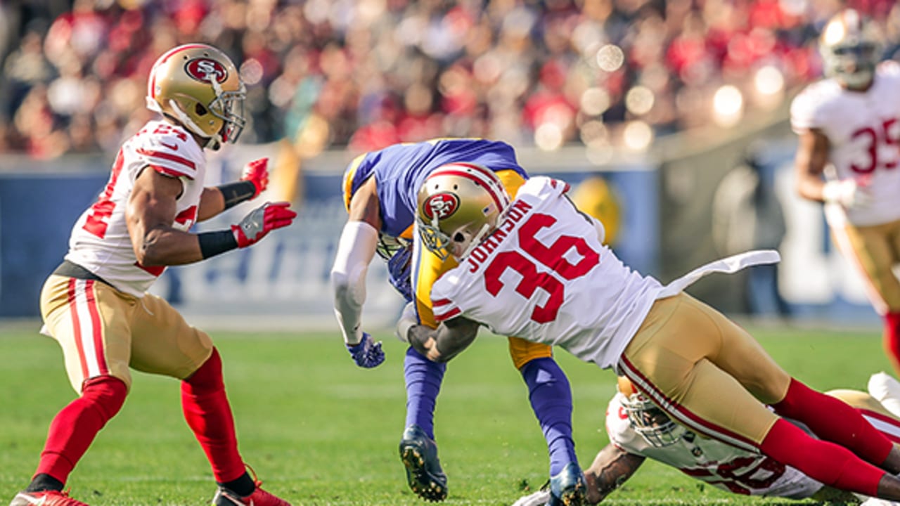 Los Angeles Rams running back Todd Gurley (30) runs for a touchdown against San  Francisco 49ers defensive back Dontae Johnson (36) during the first half of  an NFL football game in Santa