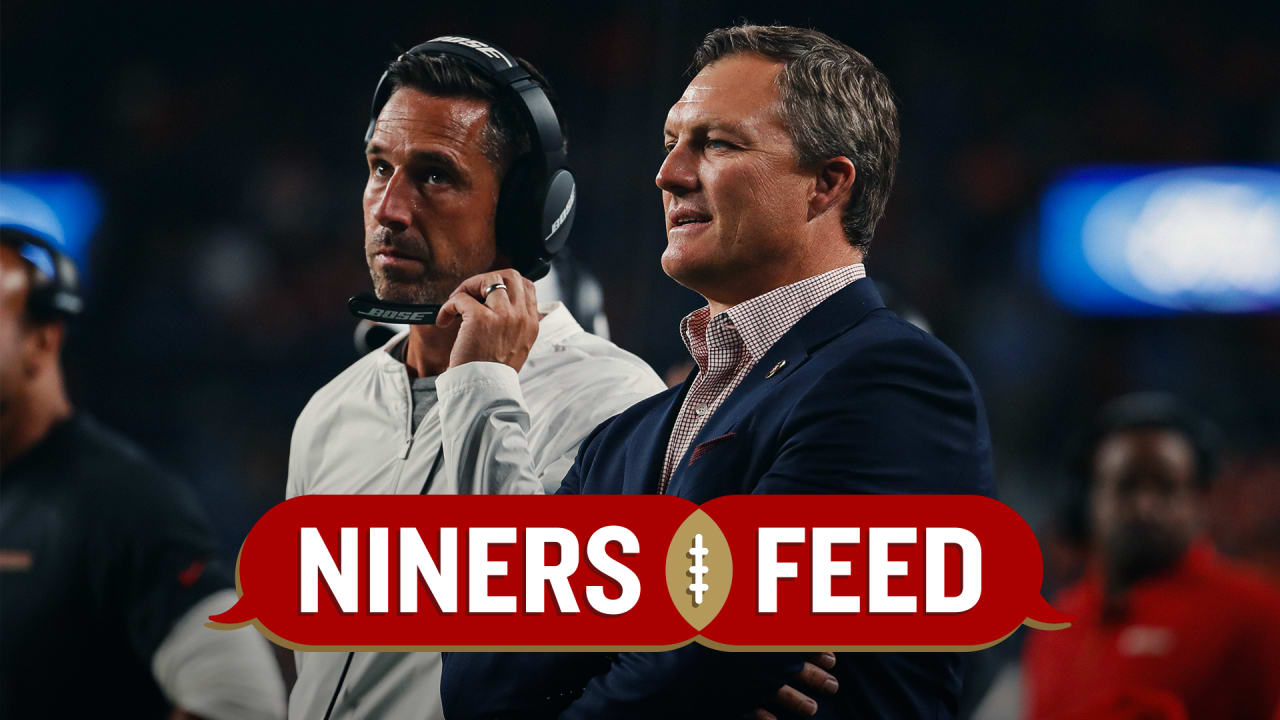 San Francisco 49ers first-round pick Nick Bosa, center, holds up a jersey  next to general manager John Lynch, left, and coach Kyle Shanahan, right,  during an NFL football news conference, Friday, April