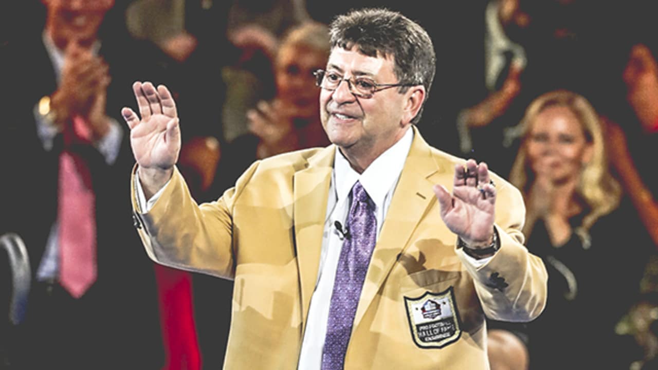 Former NFL owner Edward DeBartolo, Jr., center, is joined by Hall