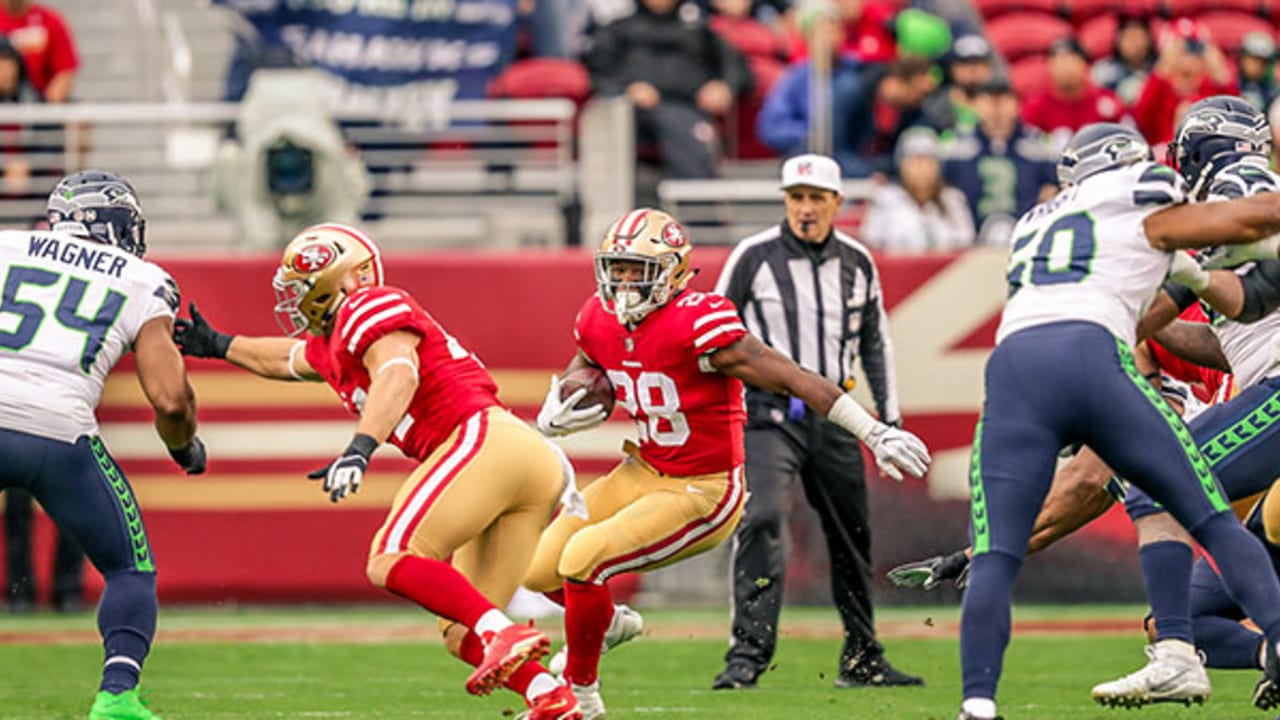 San Francisco 49ers Ronnie Lott pulls down Seattle Seahawks receiver Steve  Largent (80) for a short