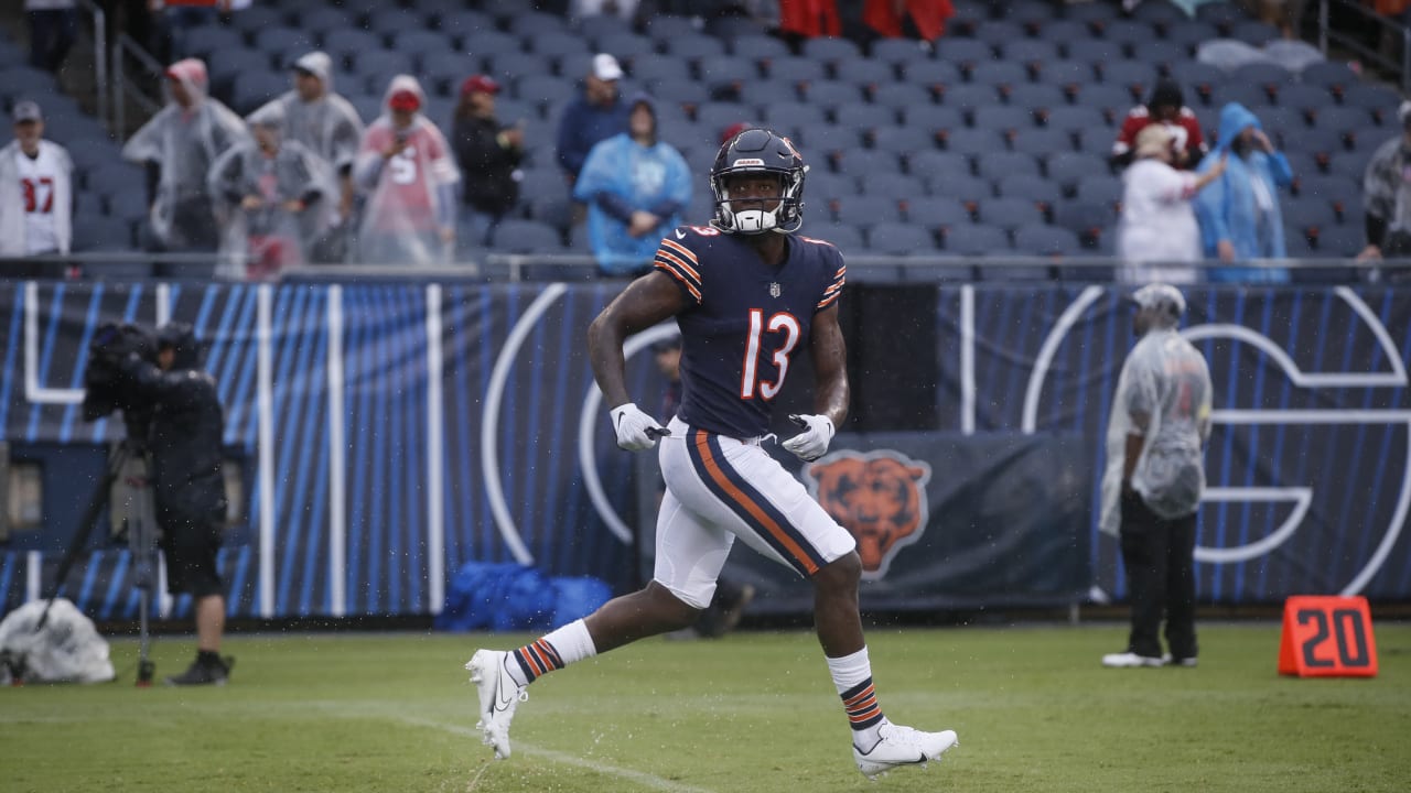 Chicago Bears wide receiver Byron Pringle (13) pulls the ball away from New  York Jets cornerback D.J. Reed (4) for a touchdown catch during the first  quarter of an NFL football game