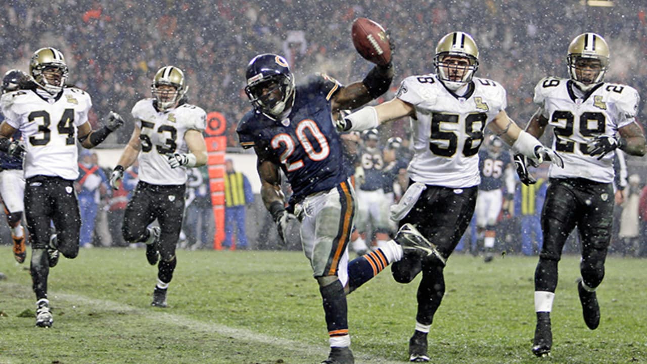 Chicago Bears' Brian Urlacher holds the NFC Championship Trophy as