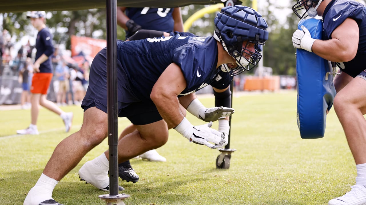 Why are NFL players wearing padding on helmets at training camp?