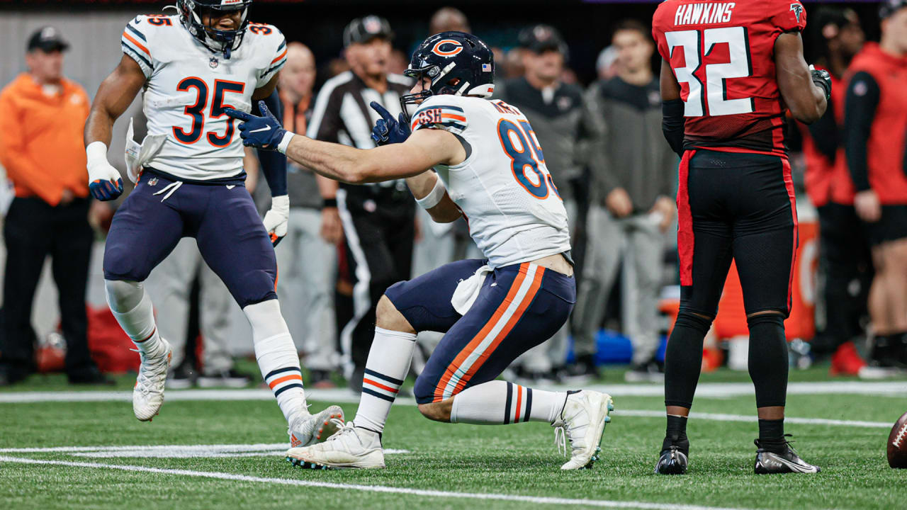 Chicago Bears tight end Cole Kmet is hit by Washington Commanders  linebacker Jamin Davis after a catch in the first half of an NFL football  game in Chicago, Thursday, Oct. 13, 2022. (