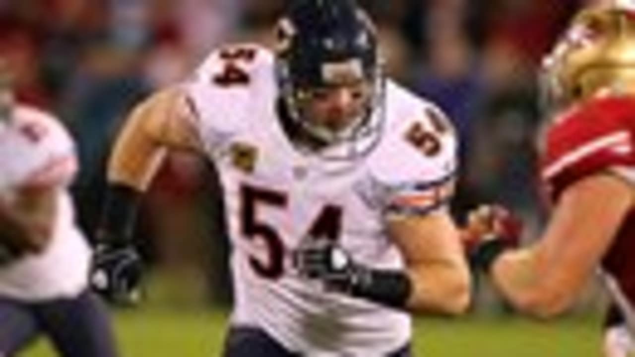 Chicago Bears' Brian Urlacher (54) holds up the NFC Championship Trophy  after the Bears beat the New Orleans Saints 39-14 in the NFC Championship  game at Soldier Field in Chicago on January