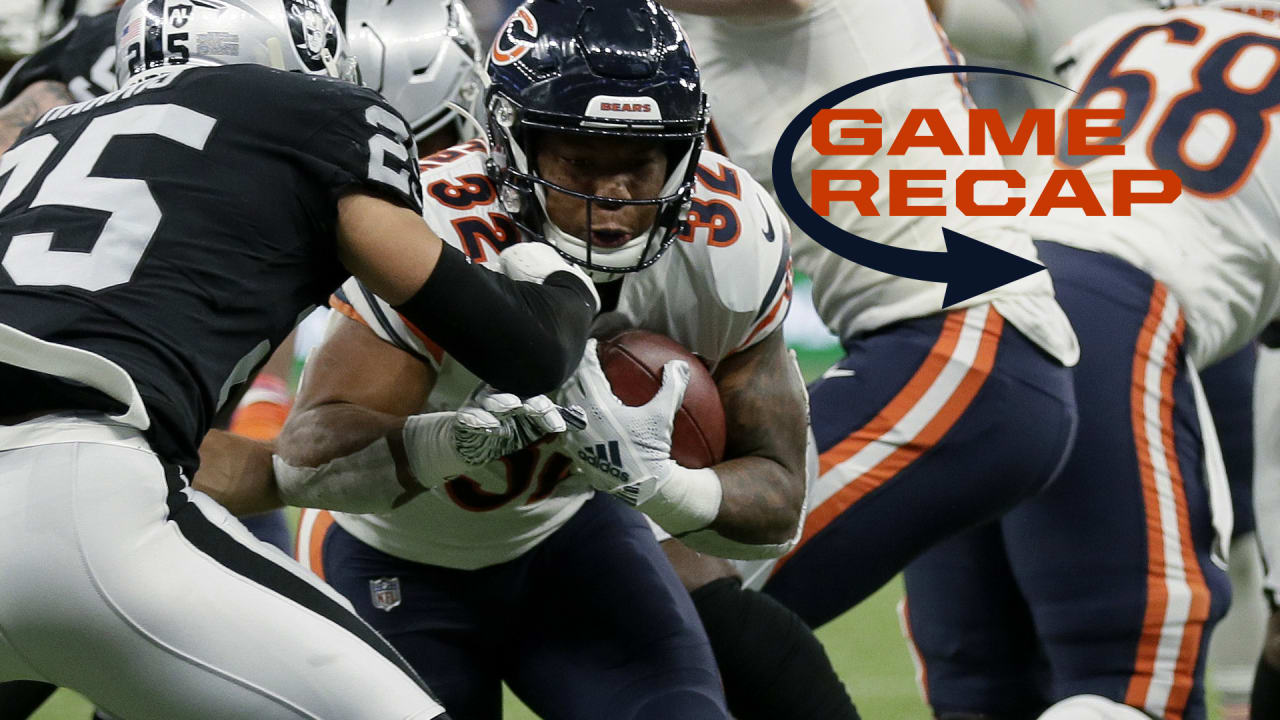 Oakland Raiders running back Josh Jacobs (28) breaks a tackle and goes in  for a touchdown during the first half of an NFL football game against the  Chicago Bears at Tottenham Hotspur