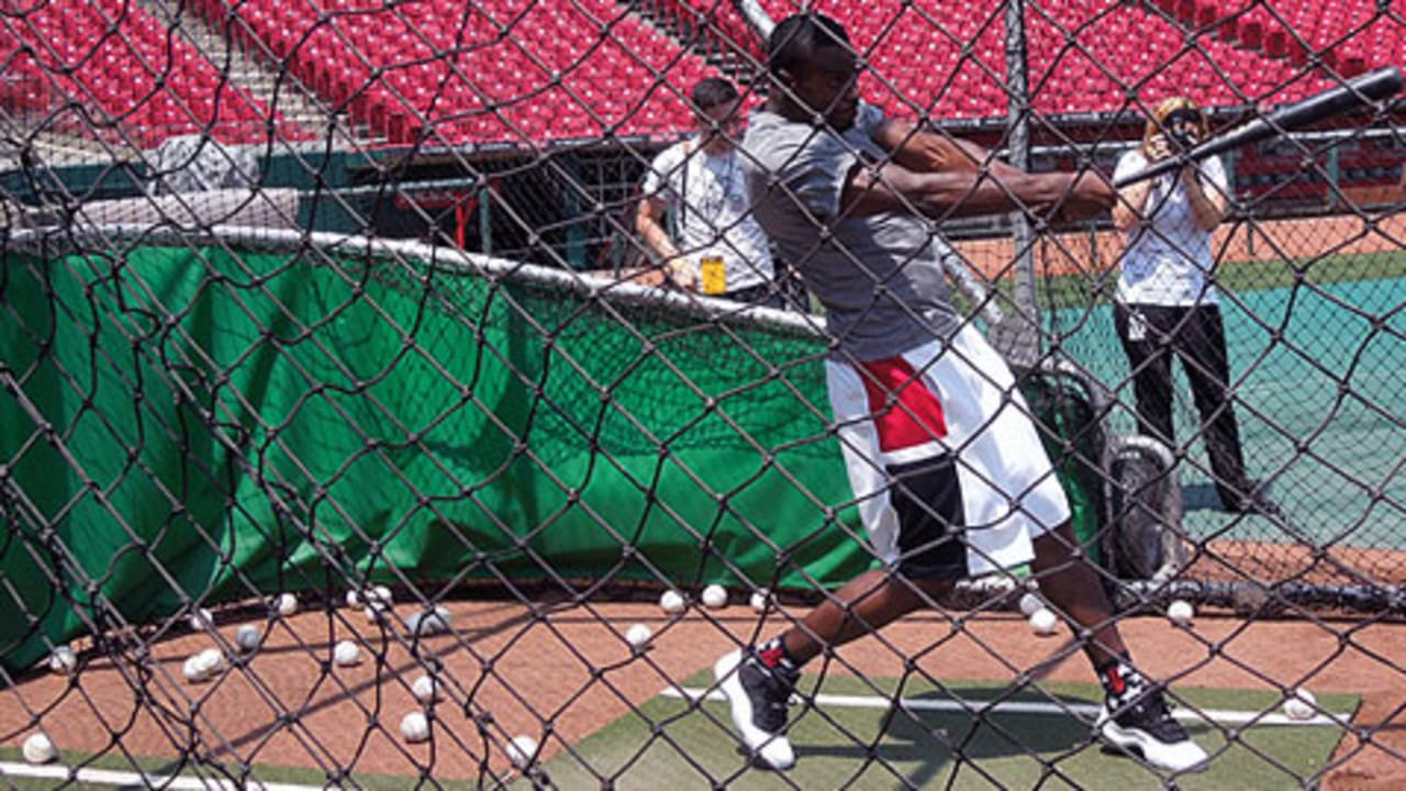 Brandon Phillips in the cage, Joey Votto fielding grounders 