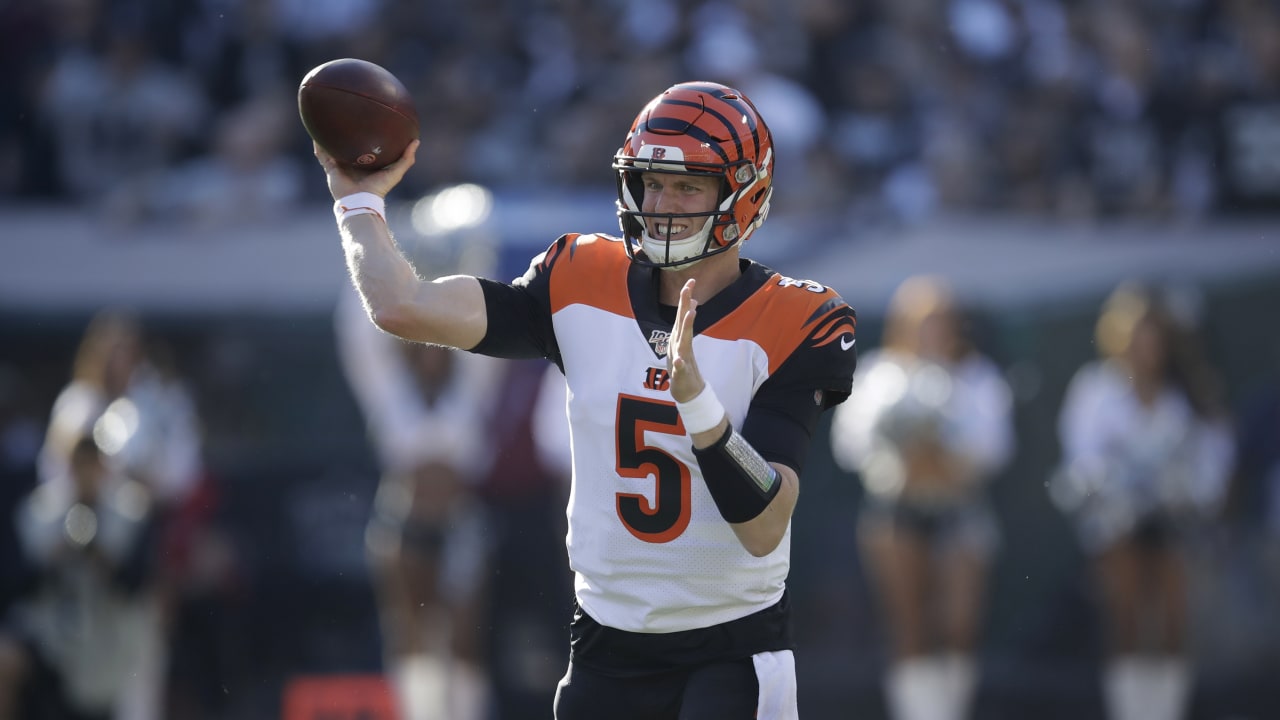 The Cincinnati Bengals look on as Bengals wide receiver Auden Tate is  carried off the field aft …