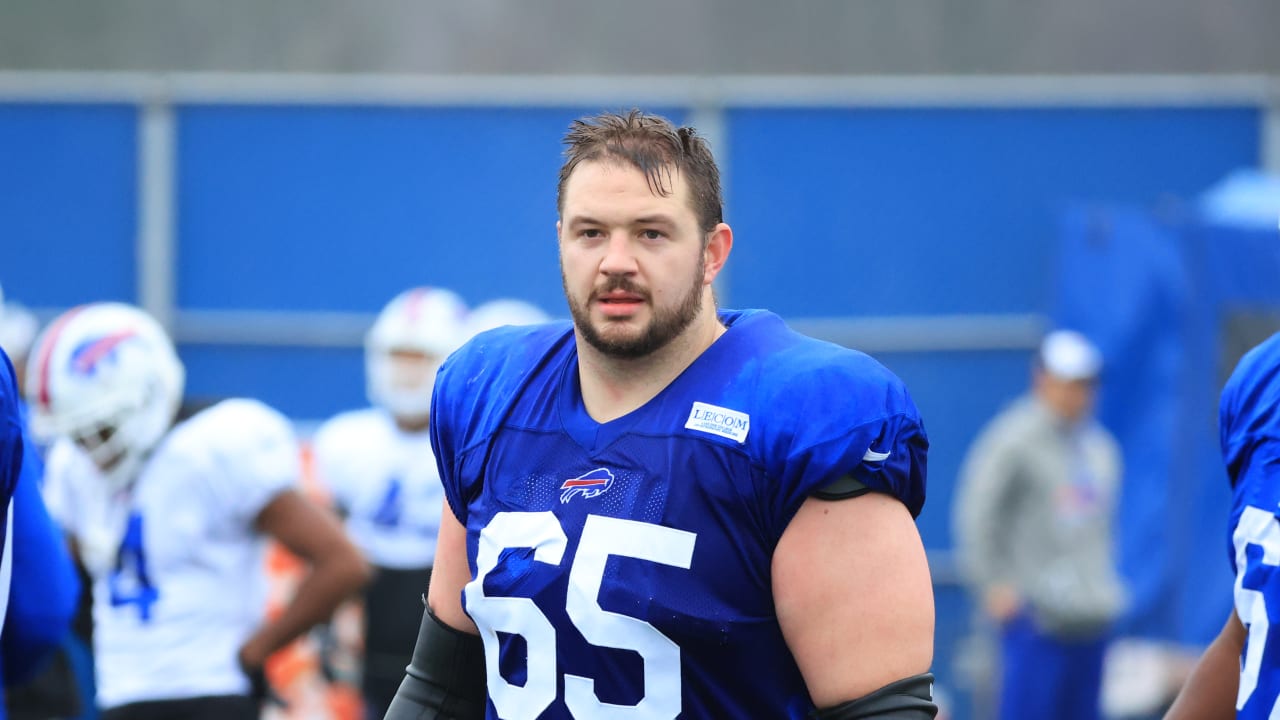 Buffalo Bills guard Ike Boettger, right, runs a blocking drill