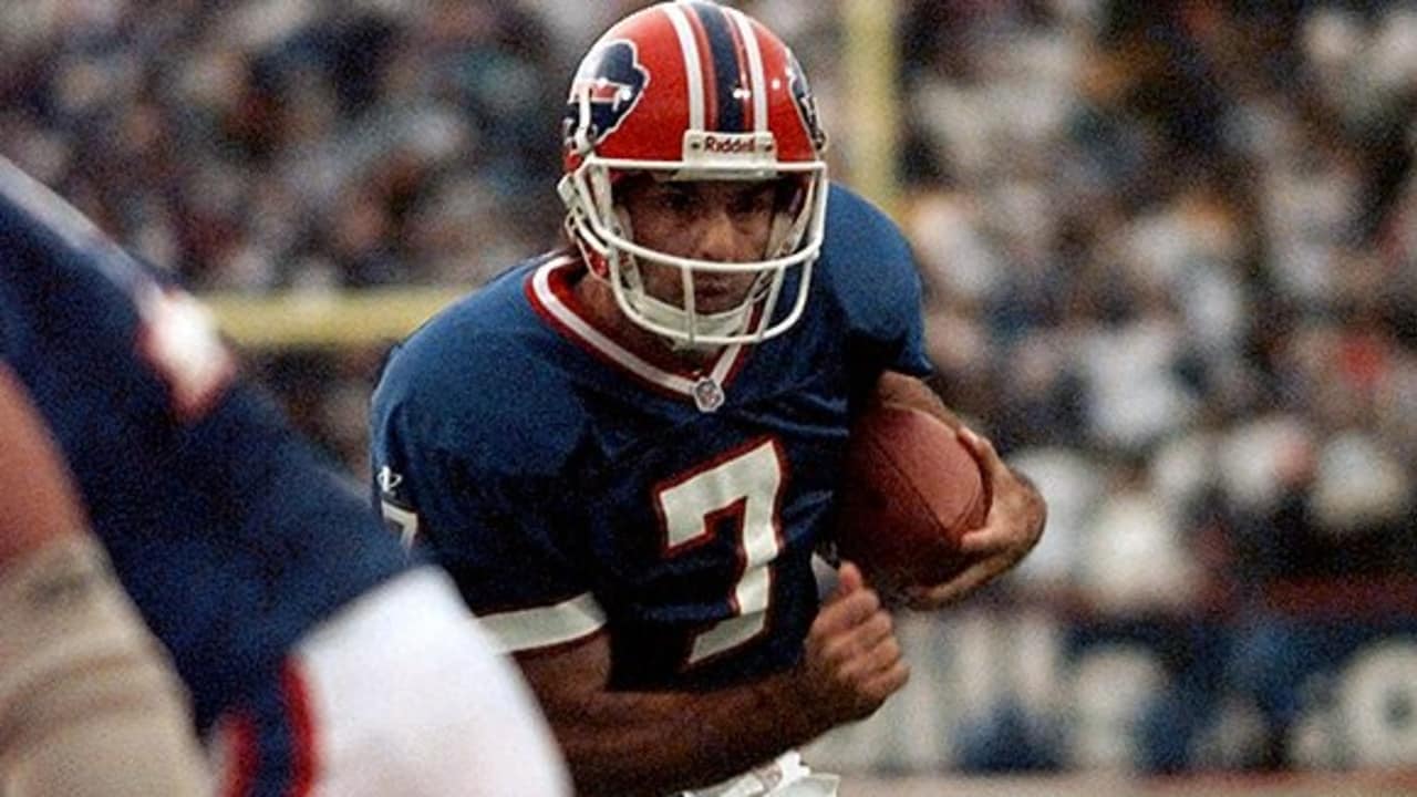 A close up of Doug Flutie of the Buffalo Bills as he signals to