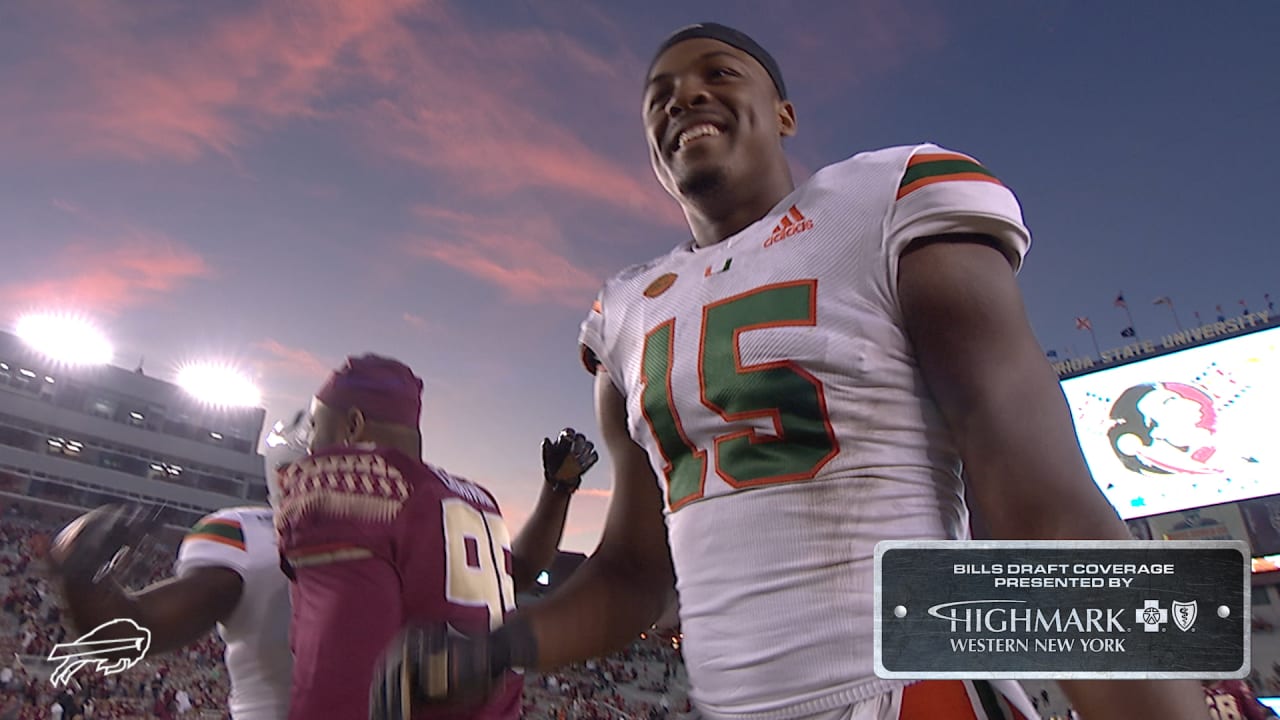 Miami edge rusher Gregory Rousseau, right, holds a team jersey