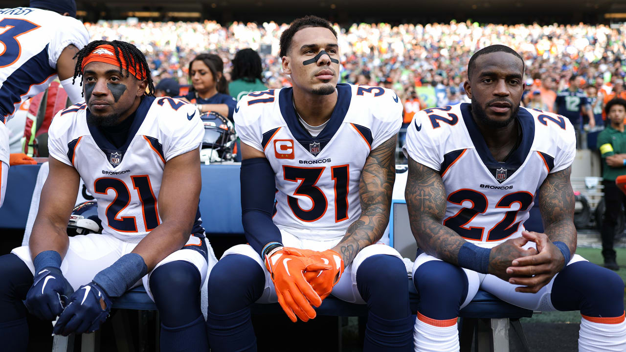 Denver Broncos safety Delarrin Turner-Yell (32) reacts after