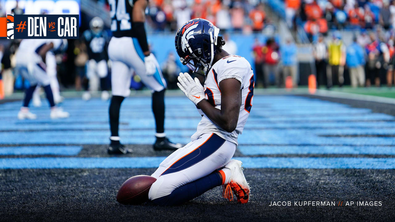 Denver Broncos Wide receiver Brandon Lloyd runs with the football