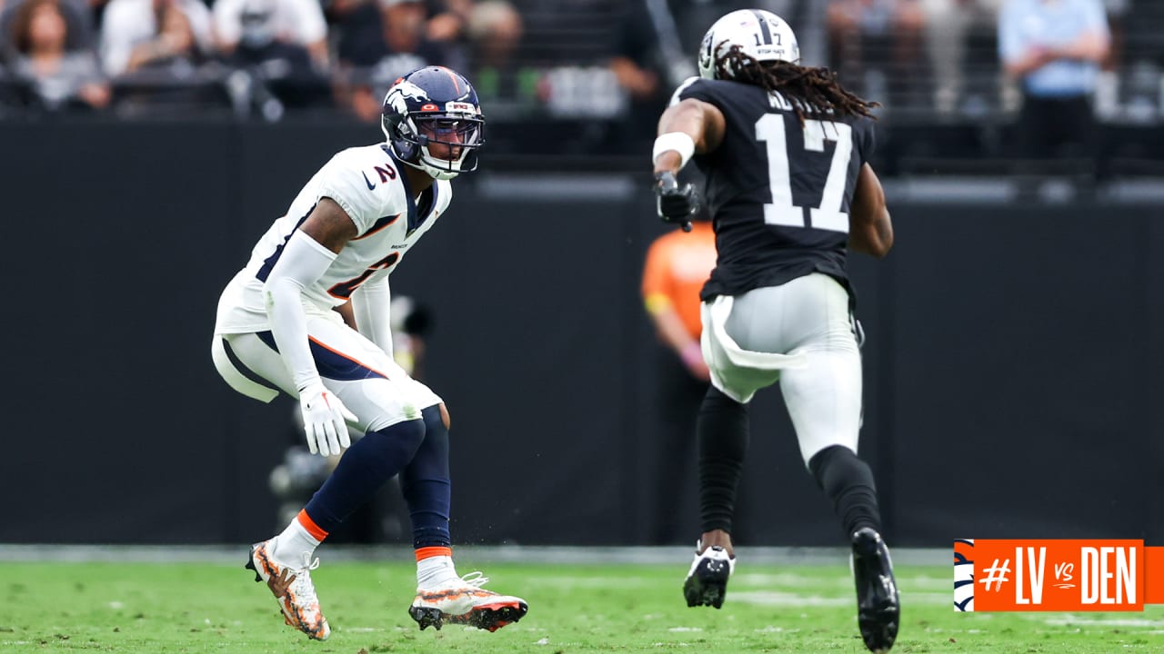 Wearing his Playstation 2 cleats Denver Broncos cornerback Pat