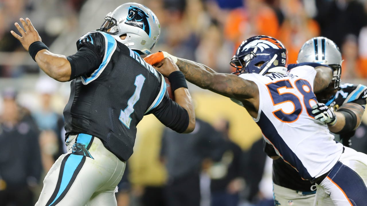 Denver Broncos DeMarcus Ware (94) and Malik Jackson wrap up