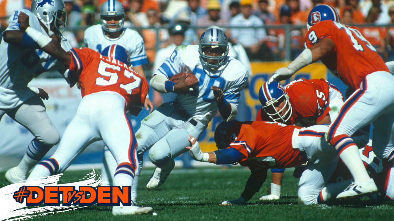 Denver Broncos defender Billy Thompson reaches for Detroit Lions running  back Billy Sims (20) on Oct. 11, 1981 in Denver, as Sims steps over two of  his players on his way to