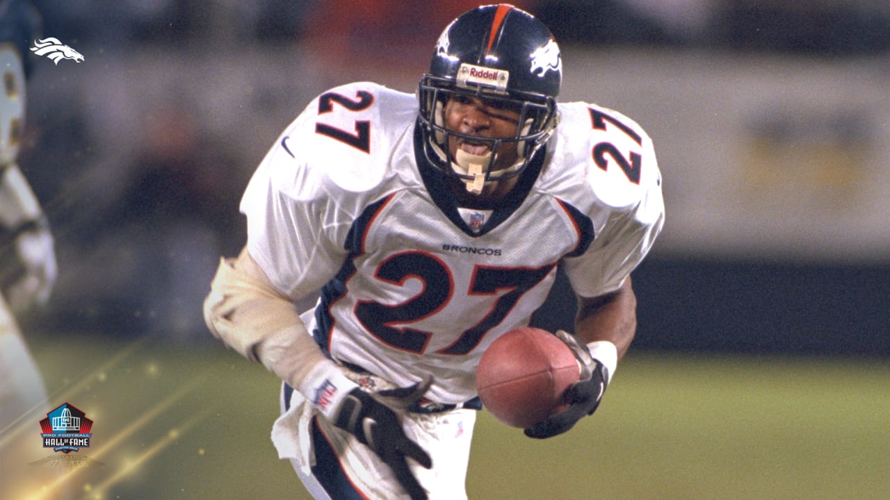 Denver Broncos running back Terrell Davis rushes past the News