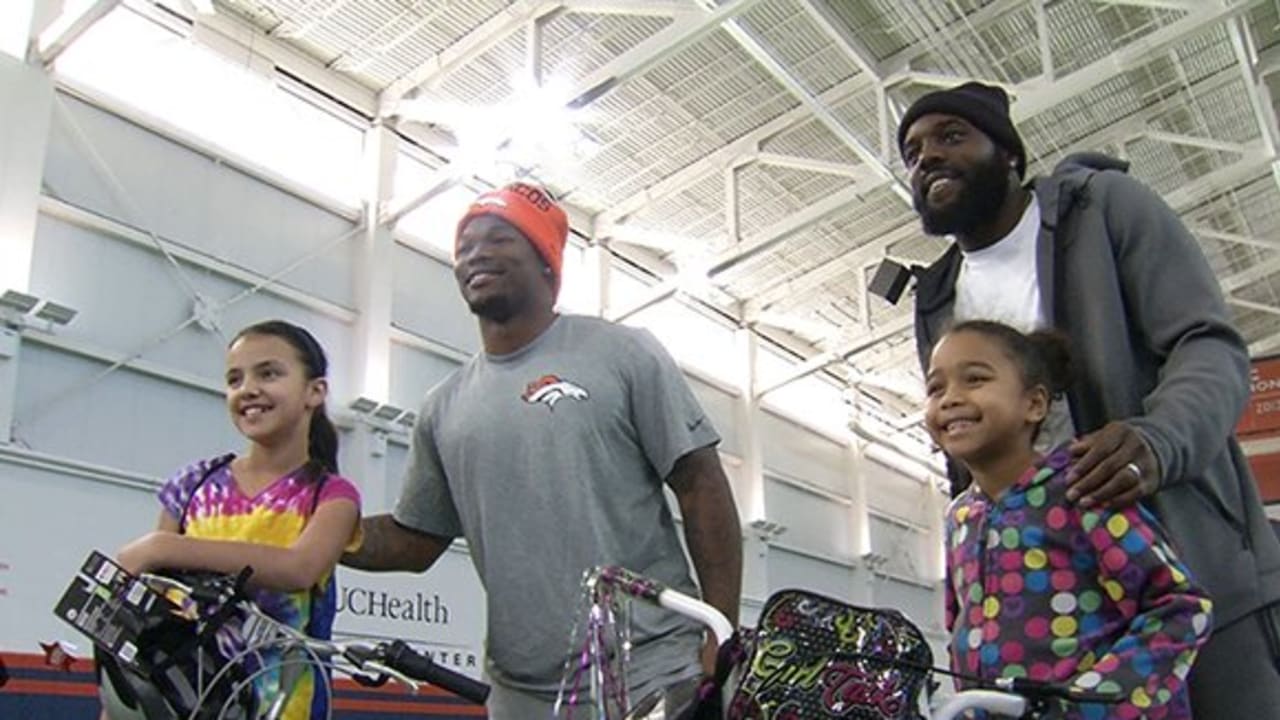 Broncos build bikes for local youth in honor of former coach