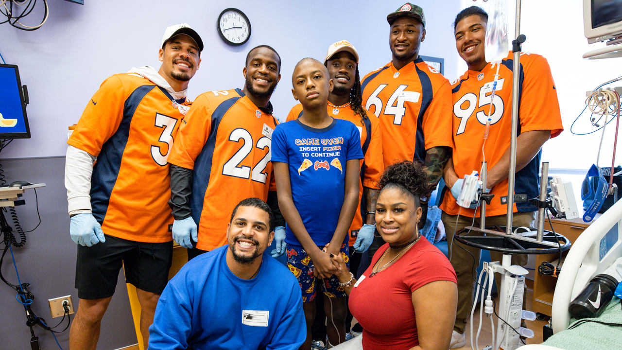 Kids go on a shopping spree with Denver Broncos players