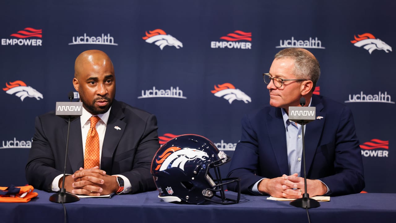 From left to right, Damani Leech, the new president of the Denver Broncos,  joins his daughters, Brianna and Simone, and wife Tamara for a photo after  an introductory news conference at the