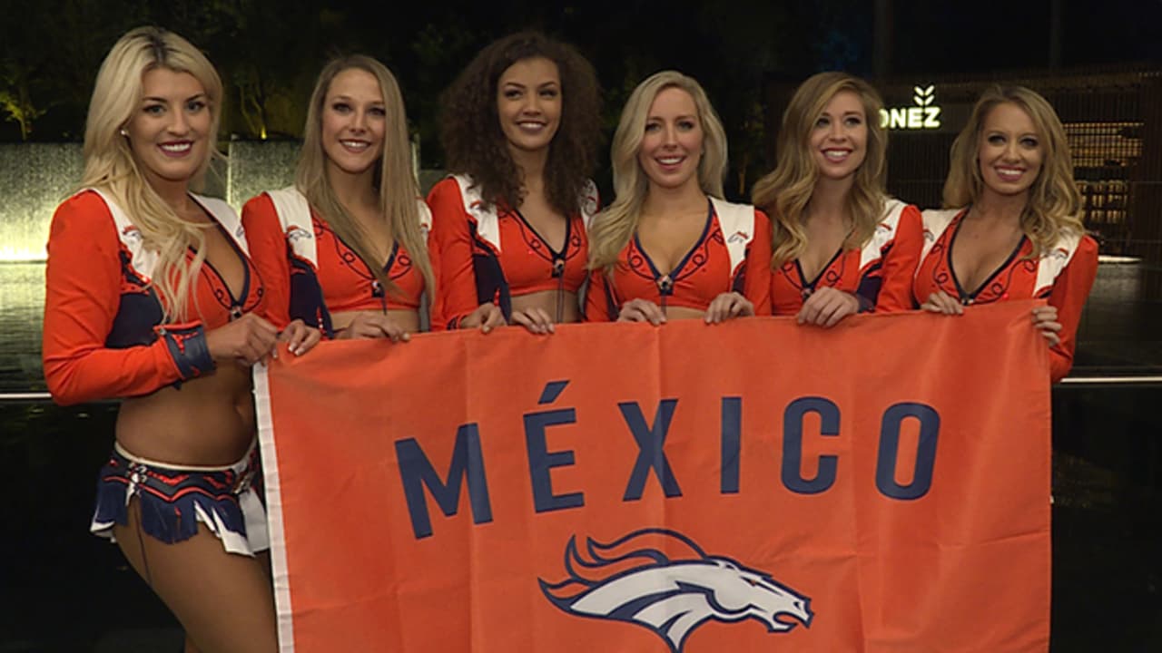 The Denver Broncos cheerleaders wear green to celebrate the NFL's