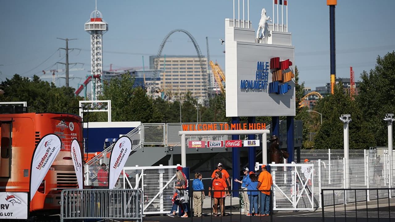 Fans explore the Mile High Monument in the north parking lot Sunday, Sept.  18, 2016, before the start of the Broncos-Colts game at Sports Authority  Field at Mile High in Denver. The