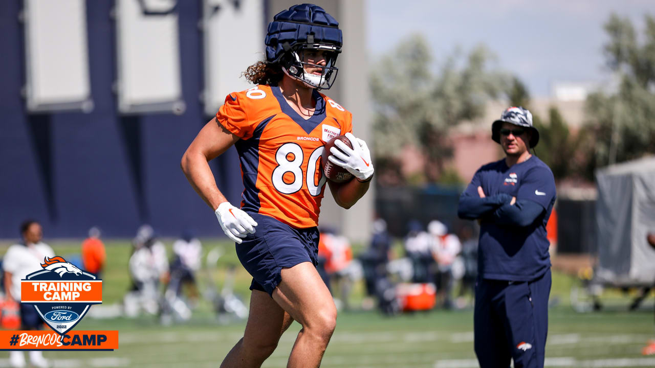 Denver Broncos tight end Greg Dulcich (80) takes part in drills